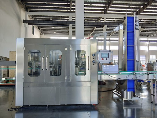 Máy rửa chai, chiết rót, xoắn nắp ( 3 trong 1 ) tại công ty Đức Phát